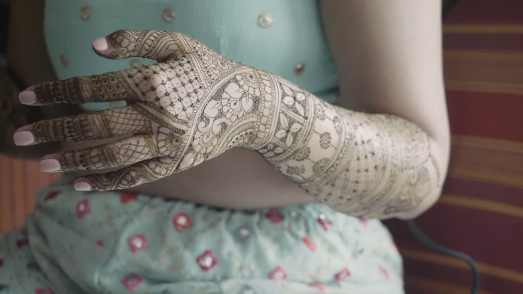 Applying mehendi 
